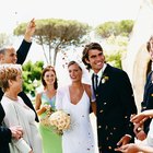 Hispanic bride with mother and young girl smiling