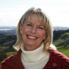 Mature woman laughing, eyes closed, close-up