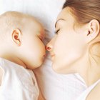 Loving mother with sleeping infant
