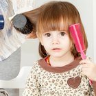 Toddler child getting his first haircut