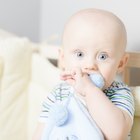 a caucasian baby begins to cry loudly