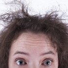 Smiling woman combing her hair