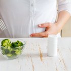 Pregnant woman eating vegetables