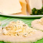 Variety of cheeses on cutting board