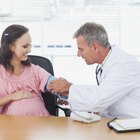 Pregnant woman with doctor