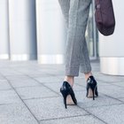 Legs of stylish woman on steps