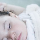 portrait of a baby boy in a crib