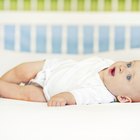 Portrait of a peaceful baby sleeping in his cradle at home