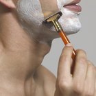 Man using electric shaver