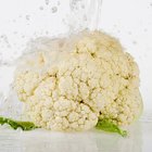 Creamy cauliflower garlic rice in a bowl on a wooden table