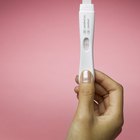 woman honding negative pregnancy test