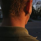 Young woman with nose studs and wearing studded ring, extreme close-up