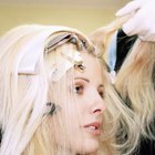 Woman brushing hair in mirror
