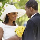 Bride and groom kissing, wedding guests applauding