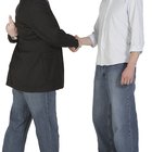 Man and woman pointing at one another