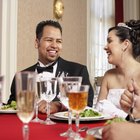 Bride And Groom Enjoying Meal At Wedding Reception