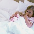 Mother reading bedtime story to daughter