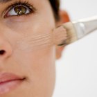 Woman applying eye cream