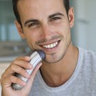 Man using electric shaver