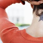 Tattooist Tattooing a Woman's Arm