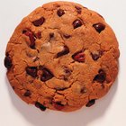 Boy (6-8) reaching into cookie jar