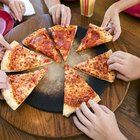 Chef making pizza on table, elevated view