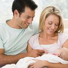 Side view of mother laughing with baby