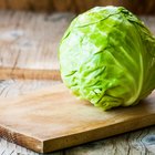 Fresh green cabbage on a wooden table