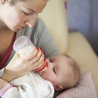 High angle view of woman breastfeeding baby