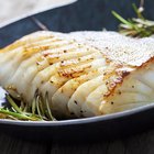 Grilled Tilapia with herbs on the wooden board