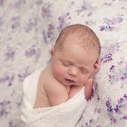 close-up portrait of a beautiful sleeping baby on white