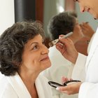 Woman applying false eyelashes