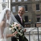 bride smelling flowers