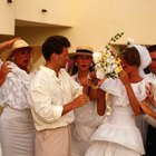 Bride holding bouquet beside groom