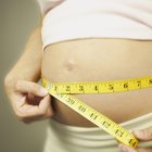 Pregnant woman watching baby on ultrasound scanner, elevated view