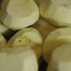 Peeling potatoes on the wooden table horizontal