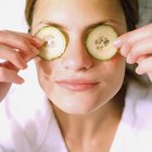 Woman applying cream under eye