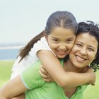 Mother and Daughter looking at camera on the beach