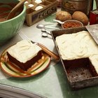 chocolate brownie diced baking paper on wooden table with a