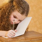 Boy writing at school