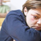 Sad woman thinking on couch after fight with husband
