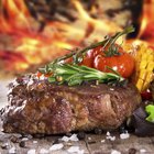 Raw pork chop steak on wooden background