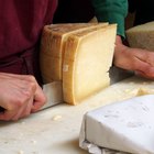 Variety of cheeses on cutting board