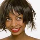 Low angle view of a young woman waiting in a beauty salon, smiling