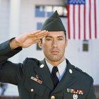 Man dressed in camouflage in front of truck