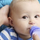 Mother kissing sleeping infant