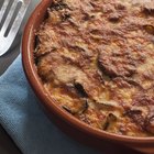 Garlic bulb in plate with eggplant, directly above