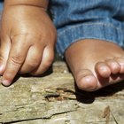 Grandmother's Hands Holding Newborn's Feet