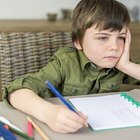 Frustrated girl sitting at table