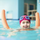 Sweet little girl in swimming pool